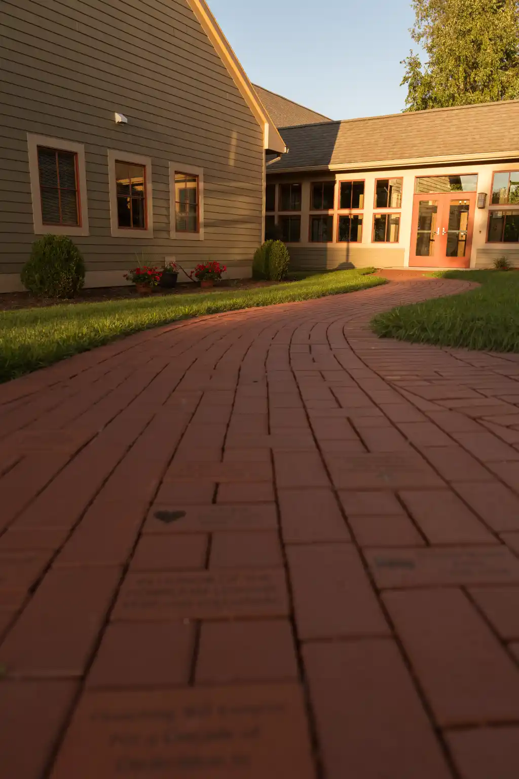 Engraved brick walkway leading to the Hospice of Lenawee building.