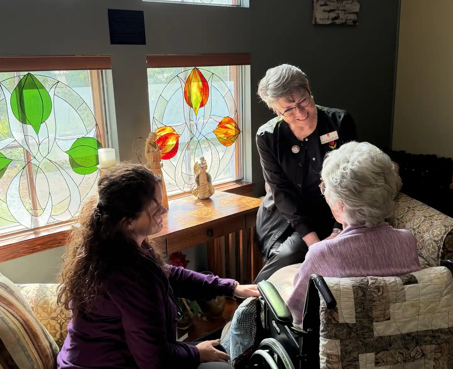 Hospice of Lenawee team members gathered outdoors with a community member.